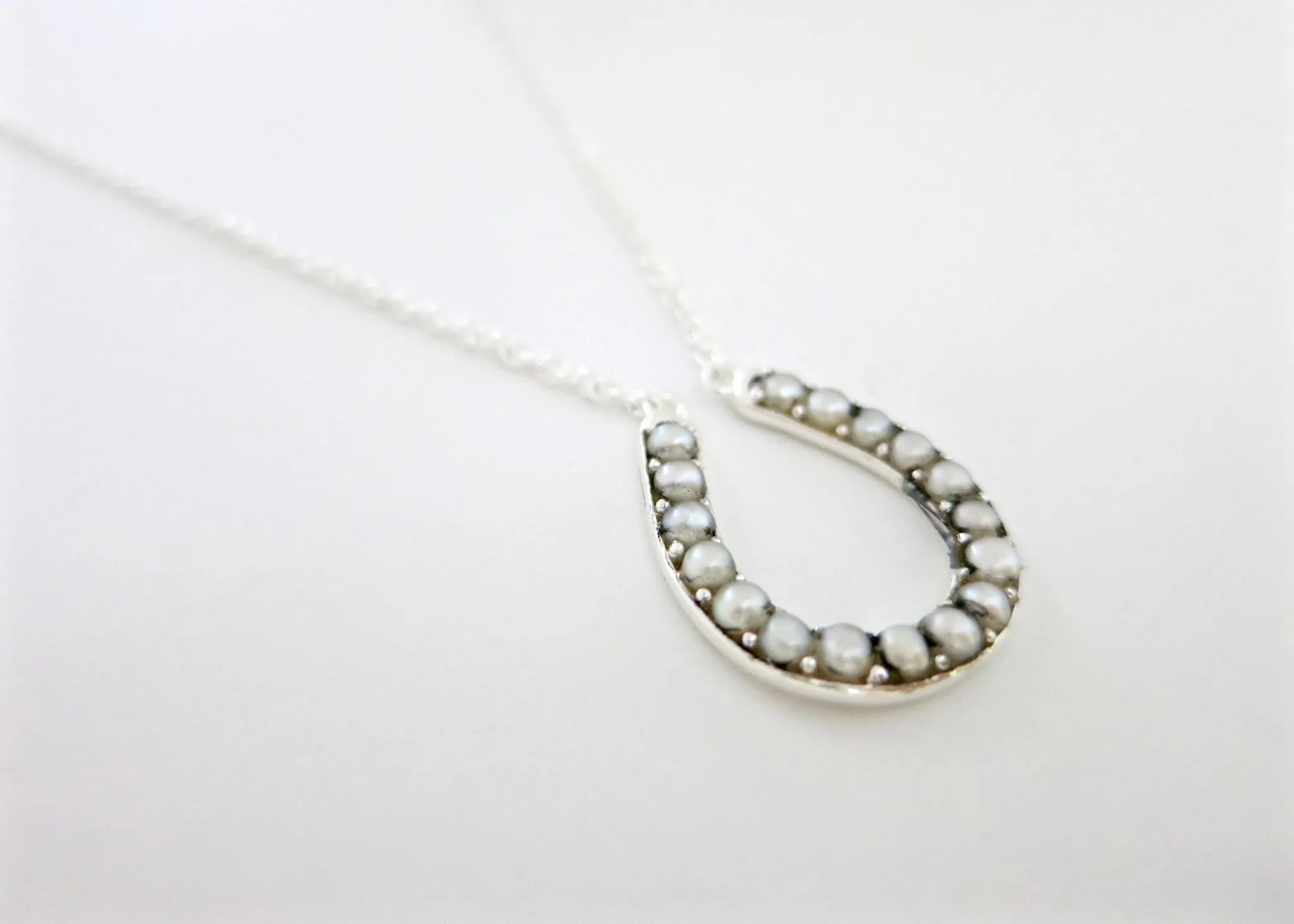 Dainty, pearl encrusted horse-shoe pendant necklace