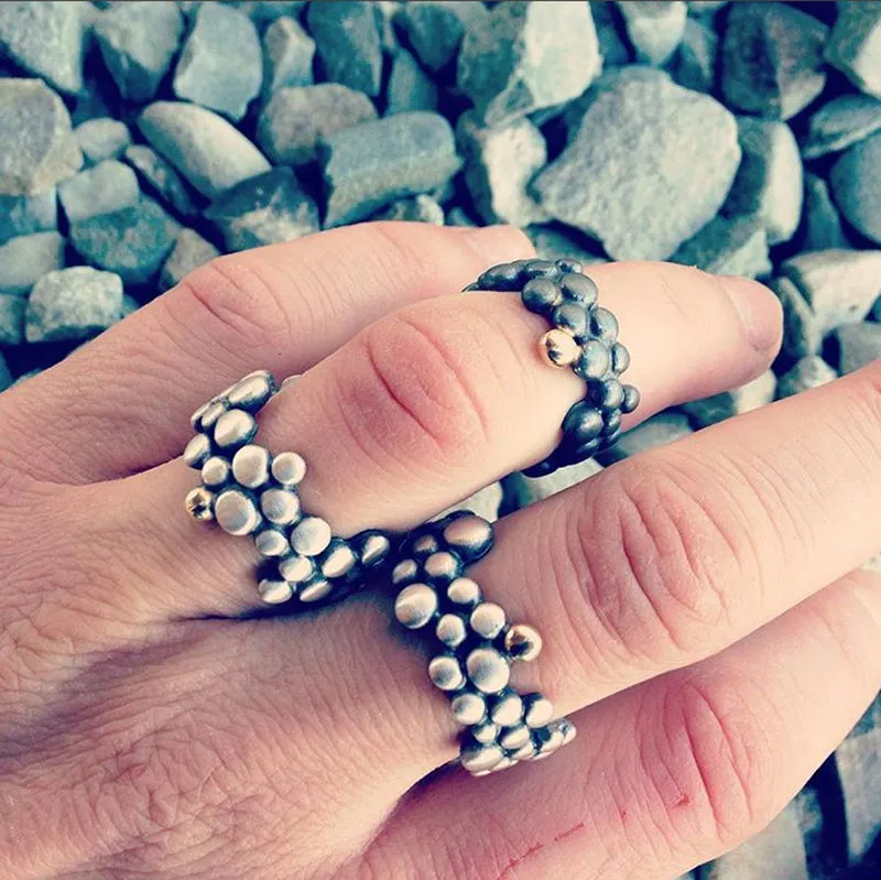 Molecular Ring Black with Gold Granule